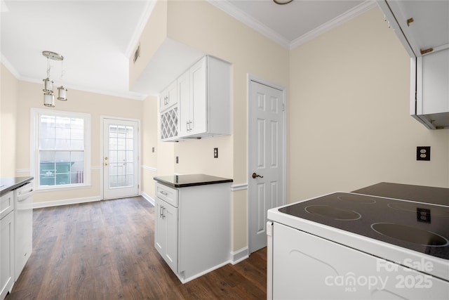 kitchen with white electric range, white cabinets, dark hardwood / wood-style flooring, hanging light fixtures, and ornamental molding