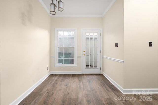 entryway featuring ornamental molding and dark hardwood / wood-style floors