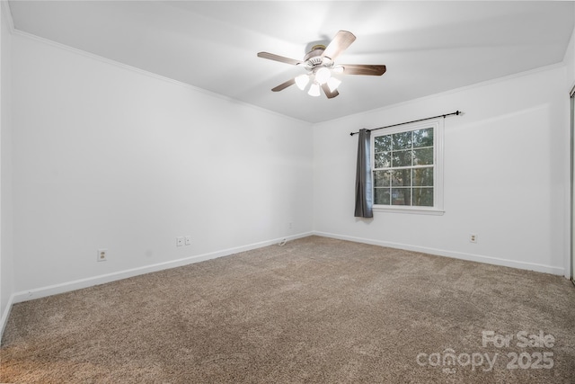 unfurnished room featuring crown molding, ceiling fan, and carpet flooring