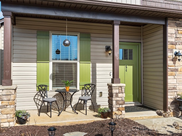 doorway to property featuring covered porch