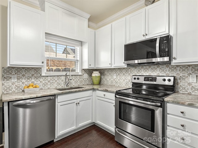 kitchen featuring stainless steel appliances, sink, and white cabinets