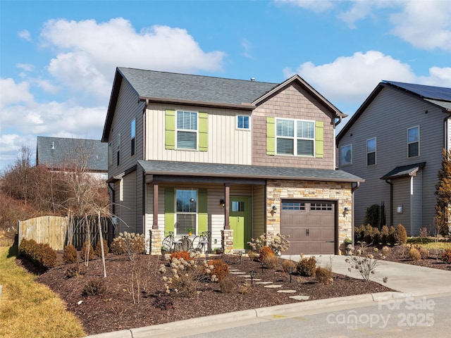 craftsman inspired home featuring a garage and covered porch