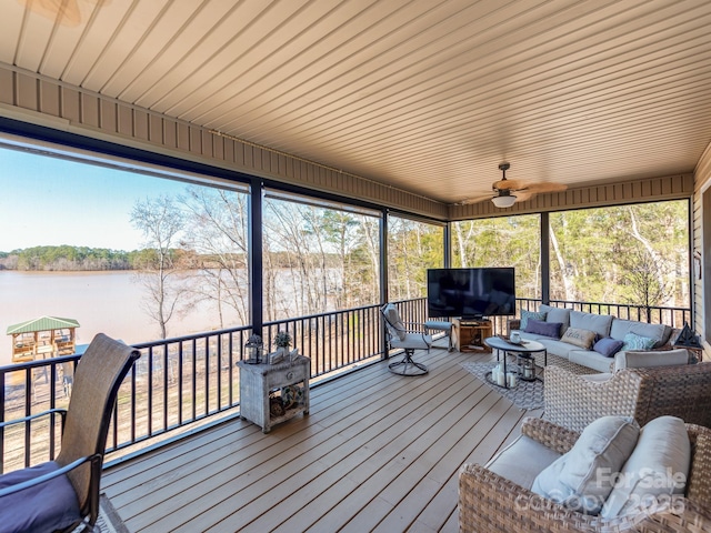 sunroom with a water view and plenty of natural light