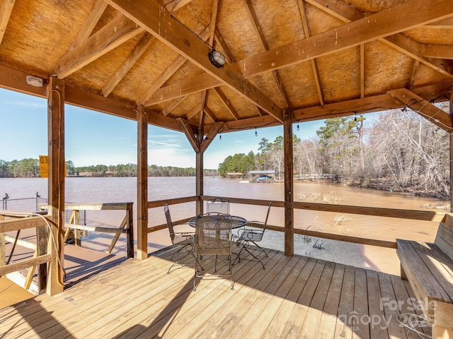 view of dock with a water view and a gazebo