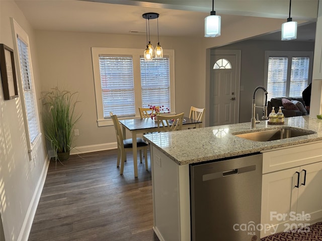 kitchen with sink, decorative light fixtures, dishwasher, light stone countertops, and white cabinets