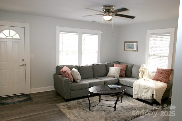 living room with dark hardwood / wood-style floors and ceiling fan