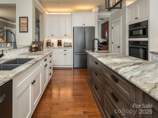 kitchen with dishwasher, white cabinets, stainless steel fridge, black double oven, and light stone countertops