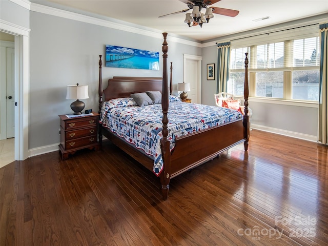 bedroom featuring ceiling fan, ornamental molding, and dark hardwood / wood-style floors