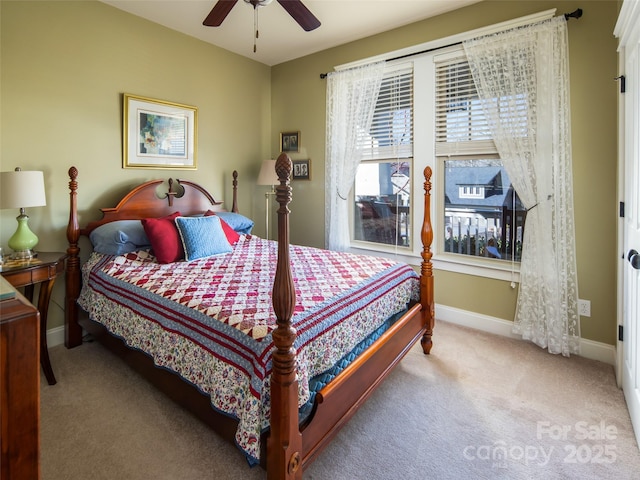 bedroom with light colored carpet and ceiling fan