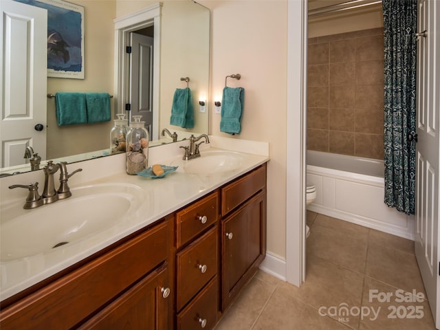 full bathroom with vanity, shower / tub combo, tile patterned floors, and toilet