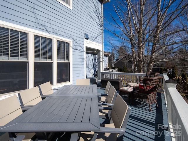 wooden deck with outdoor lounge area