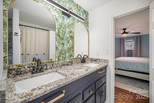 bathroom featuring vanity and ceiling fan