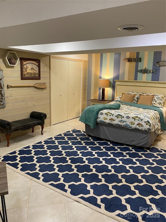 3474 Lake Wylie Dr, Rock Hill, SC 29732 - bedroom featuring wood walls, a closet, light tile patterned floors, and visible vents