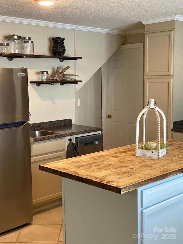 3474 Lake Wylie Dr, Rock Hill, SC 29732 - kitchen featuring crown molding, butcher block countertops, a textured ceiling, and stainless steel appliances