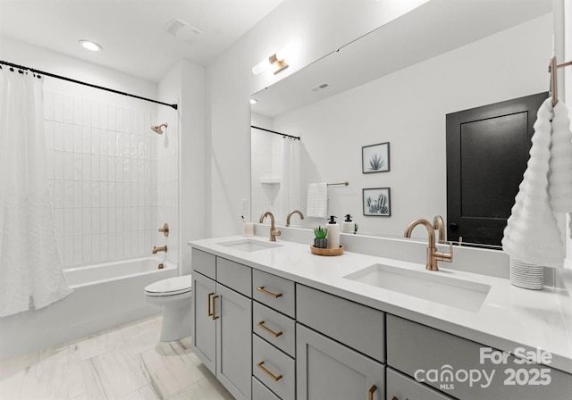 full bathroom featuring vanity, toilet, and shower / bath combo with shower curtain