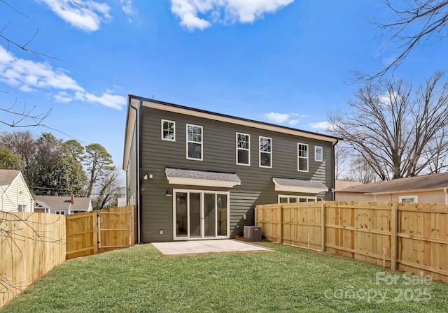 rear view of property featuring a patio area and cooling unit