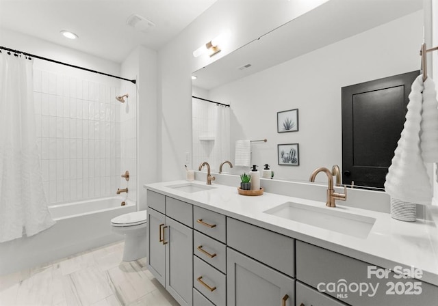 bathroom with double vanity, shower / bathtub combination with curtain, toilet, and recessed lighting
