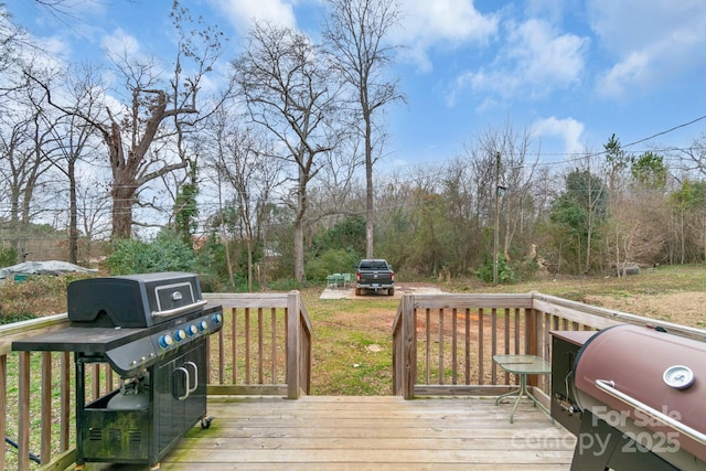 wooden deck featuring area for grilling