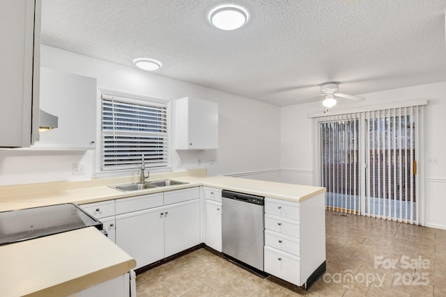 kitchen featuring sink, stainless steel dishwasher, kitchen peninsula, ceiling fan, and white cabinets