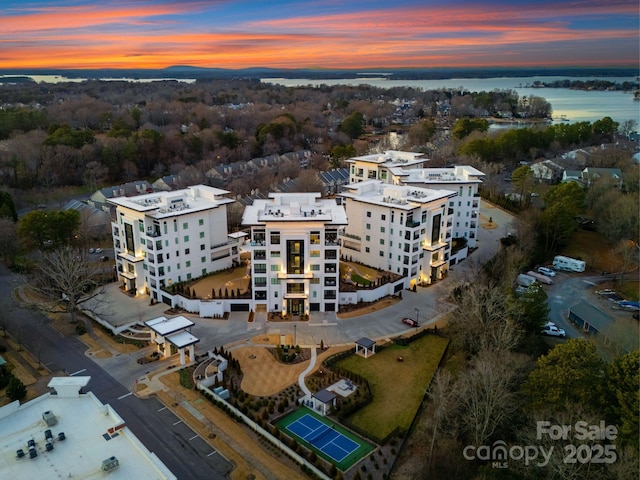 aerial view at dusk with a water view