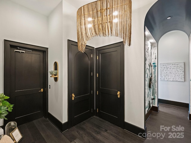 hallway featuring dark hardwood / wood-style floors