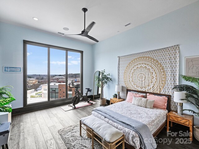 bedroom featuring hardwood / wood-style flooring, access to outside, and ceiling fan