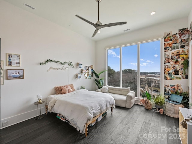 bedroom with dark wood-type flooring and ceiling fan