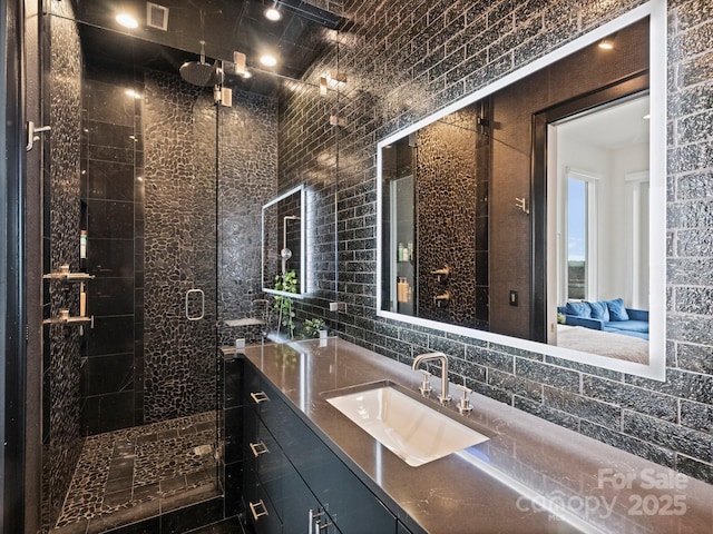 bathroom with vanity and an enclosed shower