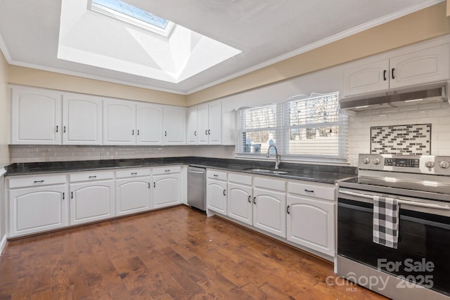 kitchen with sink, stainless steel electric range, a skylight, ornamental molding, and white cabinets