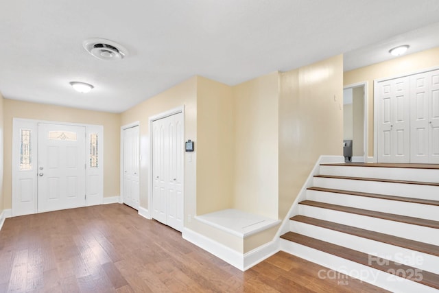 entrance foyer featuring wood-type flooring