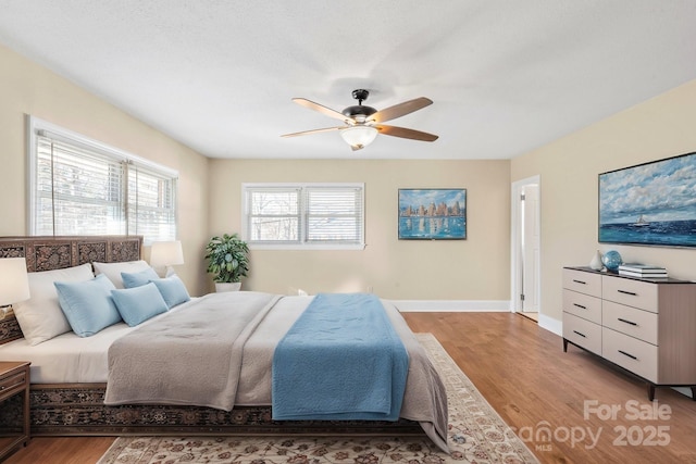 bedroom featuring ceiling fan and light wood-type flooring