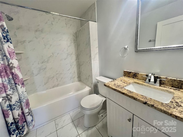 bathroom featuring toilet, marble finish floor, shower / bathtub combination with curtain, and vanity