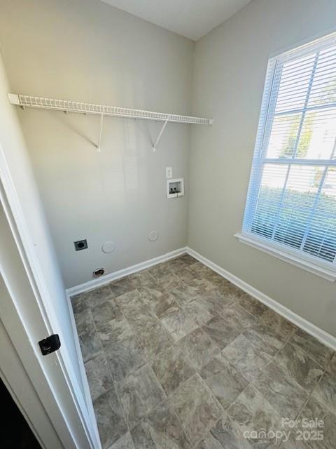 laundry area featuring gas dryer hookup, hookup for an electric dryer, and washer hookup