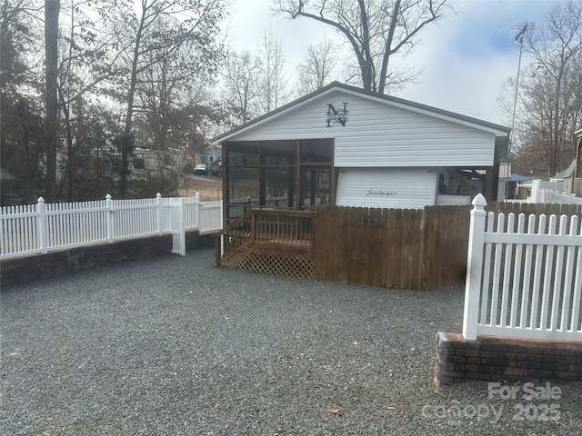 back of house with a sunroom