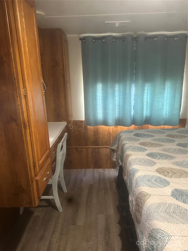 bedroom featuring dark hardwood / wood-style flooring