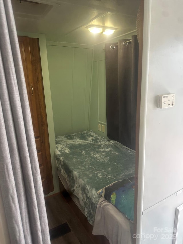 bedroom featuring dark hardwood / wood-style flooring