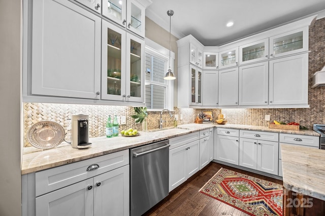 kitchen featuring sink, light stone counters, decorative light fixtures, dishwasher, and white cabinets