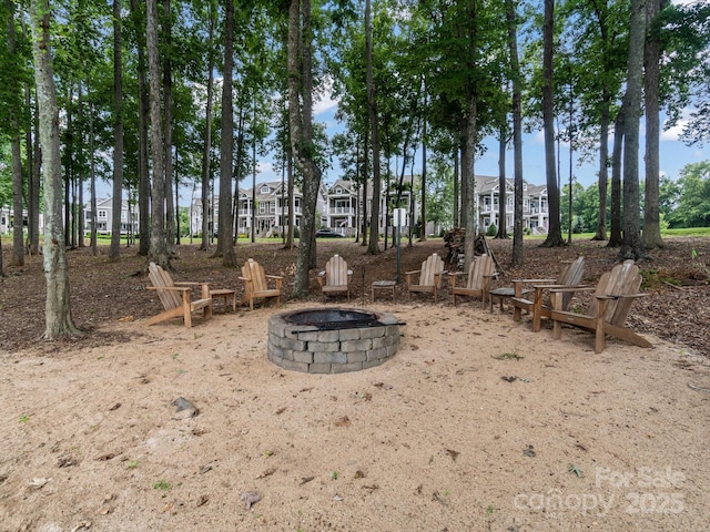 view of yard with a fire pit