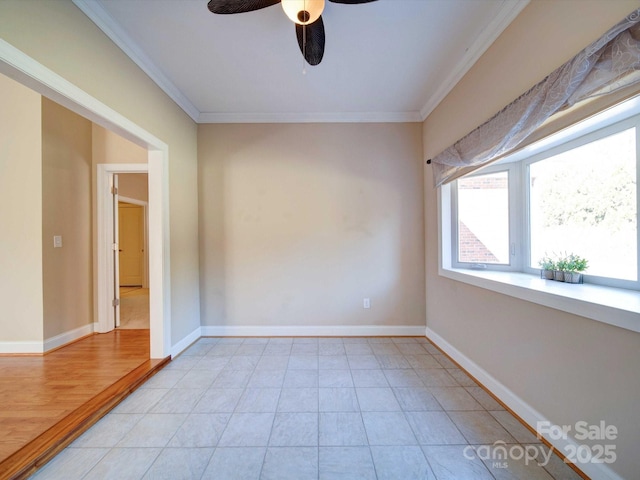 empty room with ornamental molding, ceiling fan, and light tile patterned flooring