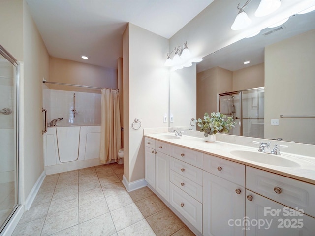 bathroom with walk in shower, vanity, toilet, and tile patterned flooring