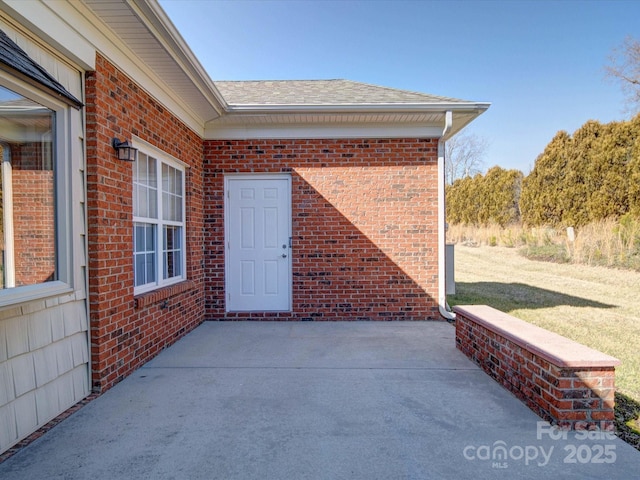 property entrance featuring a patio area