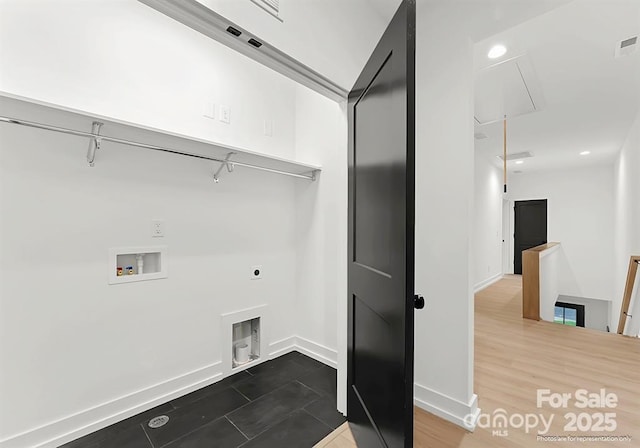 clothes washing area featuring dark wood-type flooring, hookup for an electric dryer, and hookup for a washing machine