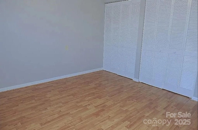 unfurnished bedroom with light hardwood / wood-style flooring