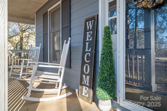 view of exterior entry featuring a porch