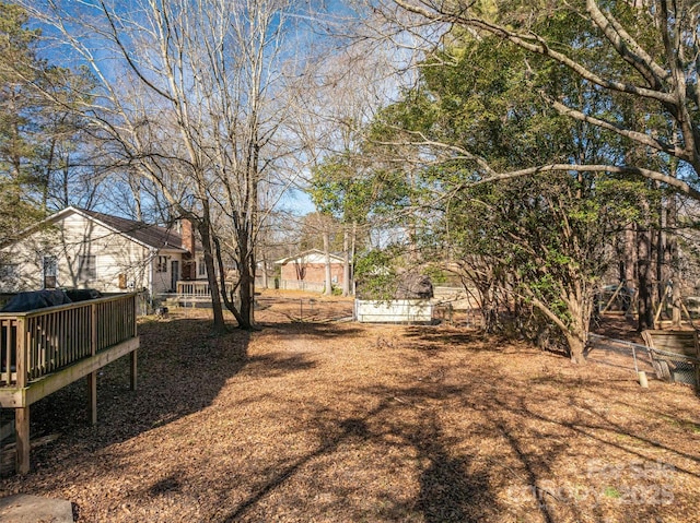 view of yard featuring a deck