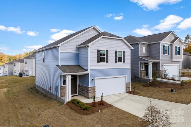 view of front of home featuring a garage and a front yard