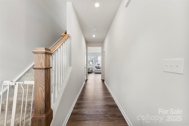 hallway featuring dark hardwood / wood-style flooring