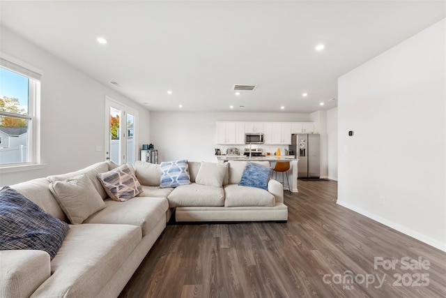 living room featuring dark hardwood / wood-style floors