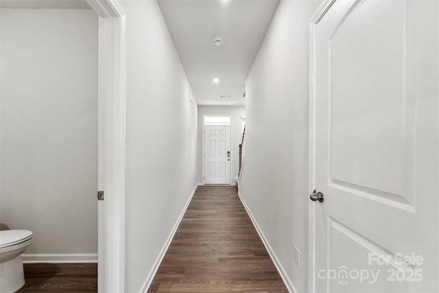 corridor featuring dark hardwood / wood-style flooring