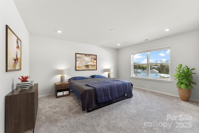 bedroom with light colored carpet